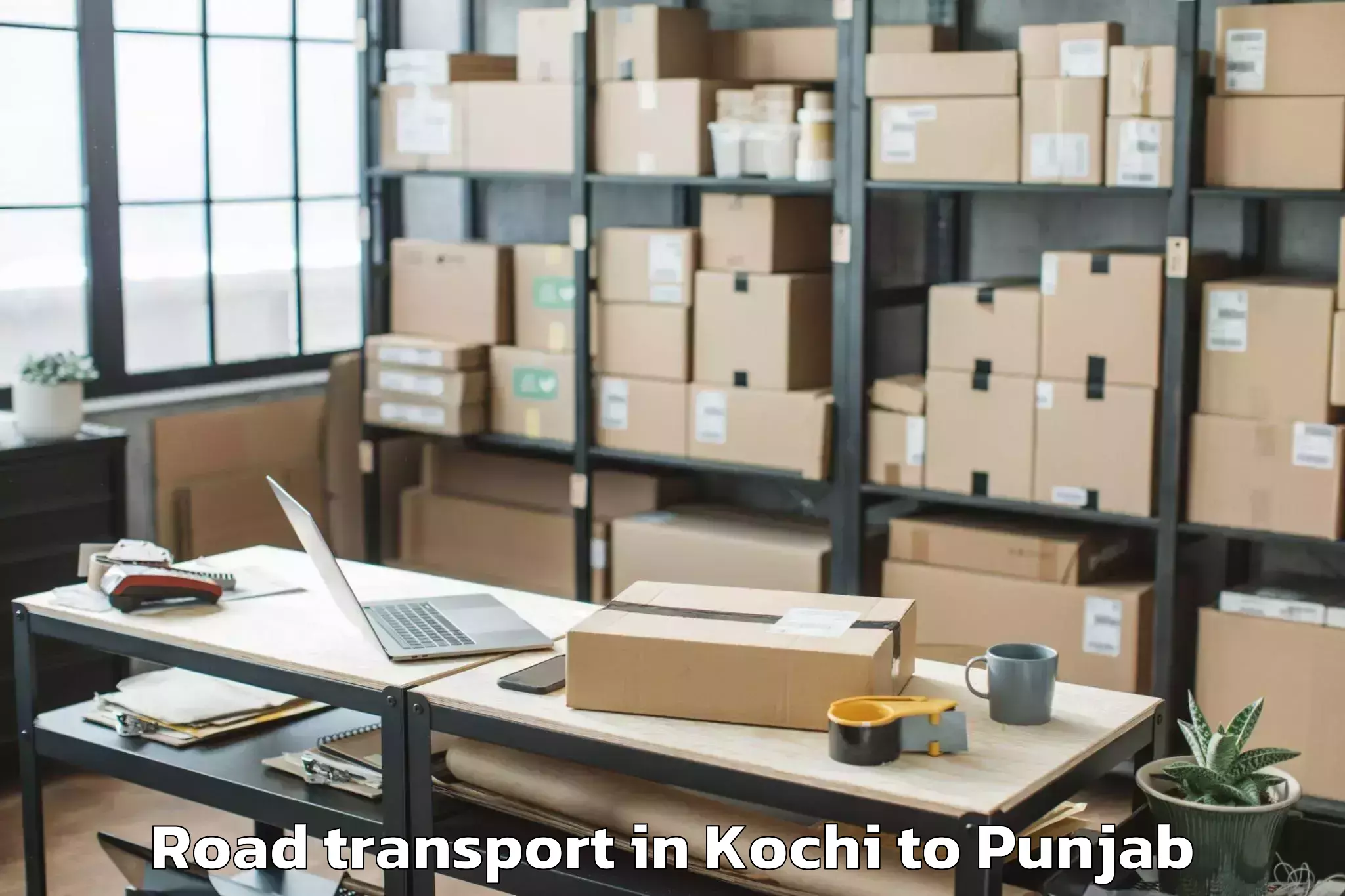 Book Kochi to Moga Road Transport